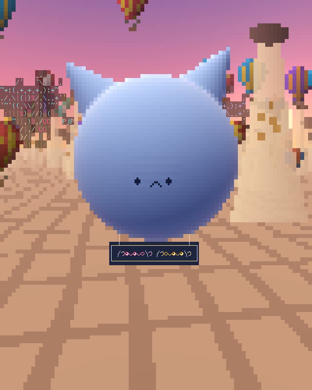 A round blue balloon with two cone ears and a small cat face floats over a dawn valley of rock chimneys and striped hot-air balloons; a small dark gondola hangs beneath with Wib and Wob's kaomoji in it